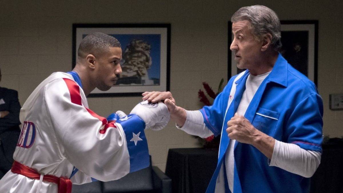 Michael B. Jordan e Sylvester Stallone em cena de Creed 2: o que aconteceu com Rocky Balboa?